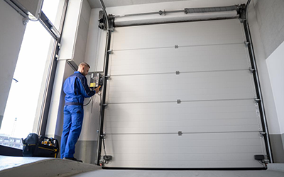 Replacing Garage Door Panels: When to DIY and When to Call a Professional